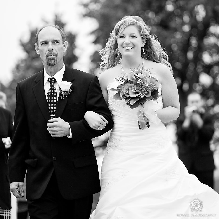 shannon the bride walks up the isle with her father