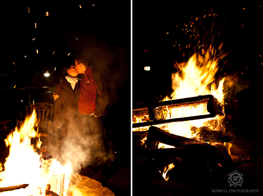 bride and groom camp fire reception kissing