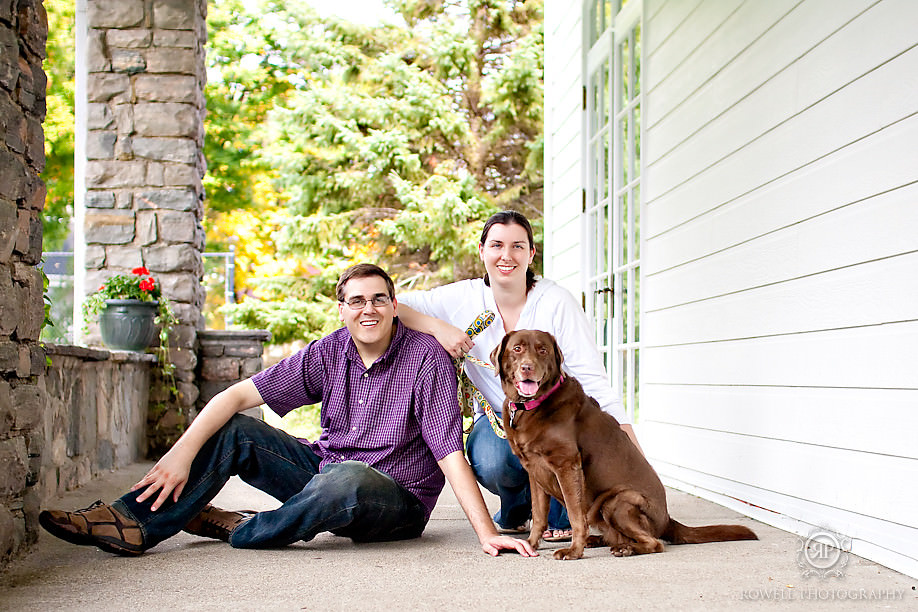 couple and puppy pose on front porch