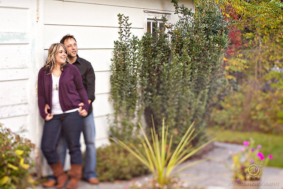 couple photo shoot in garden against white door