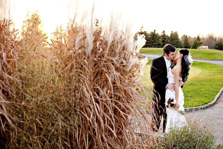 bride groom in tall grass wedding portraits