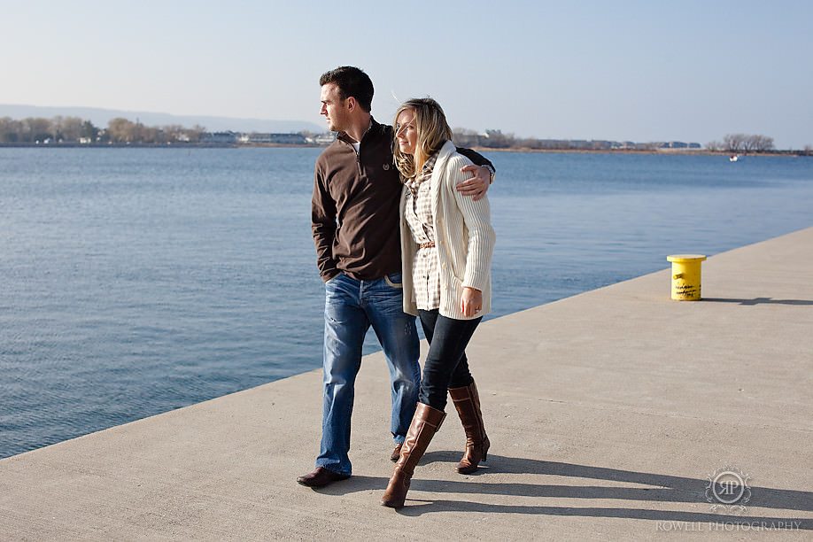 couple walking along lakeshore collingwood