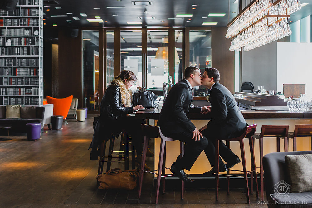 Toronto photographer captures the grooms kiss at the Thompson Hotel wedding.