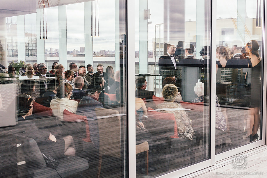 through the windows of the rooftop ceremony venue at thompson hotel