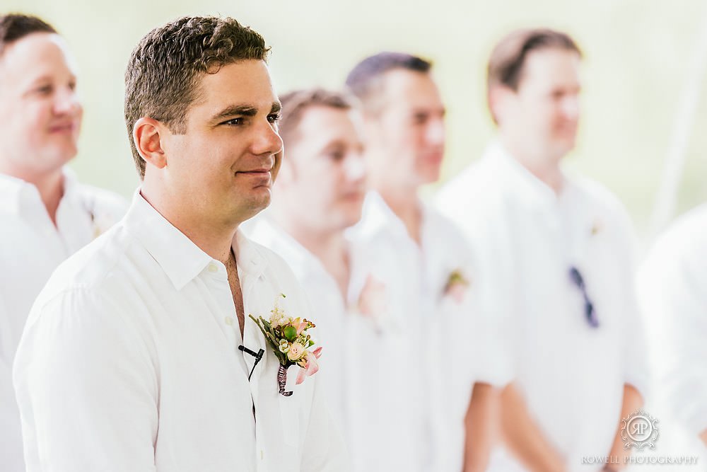 groom waiting for his bride to walk down the aisle