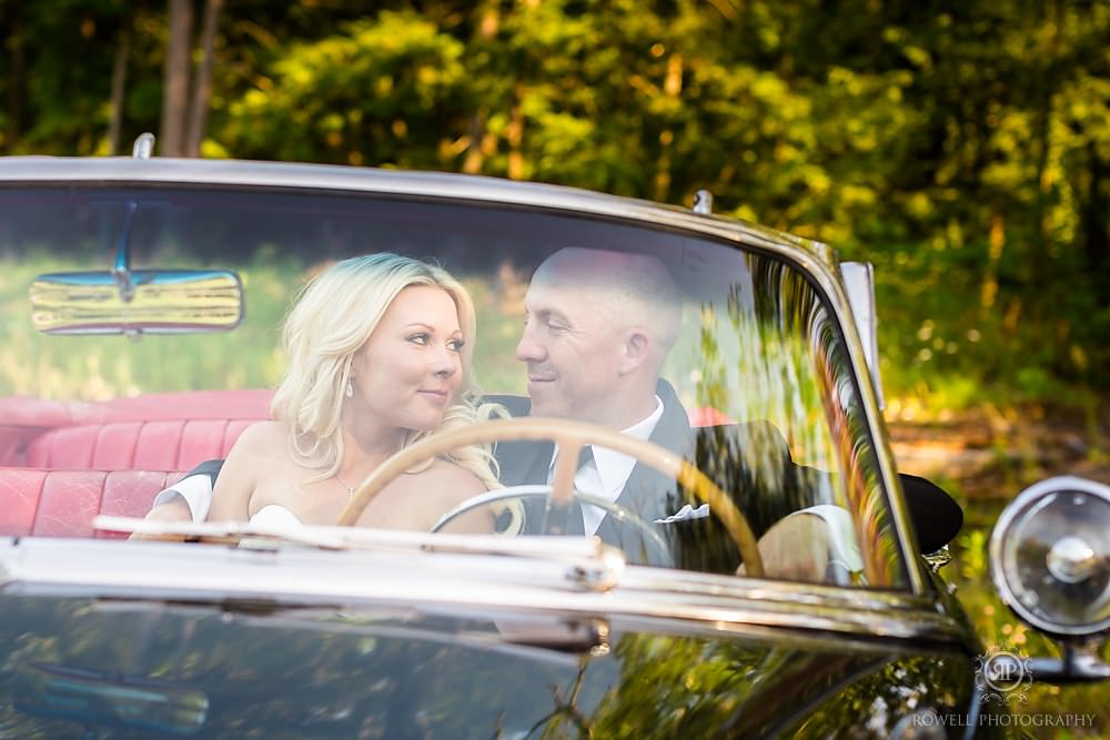 cute couples in a classic car on their wedding day