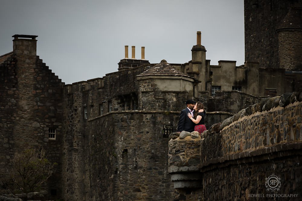 portraits of a couples at eilean donan castle in scotland