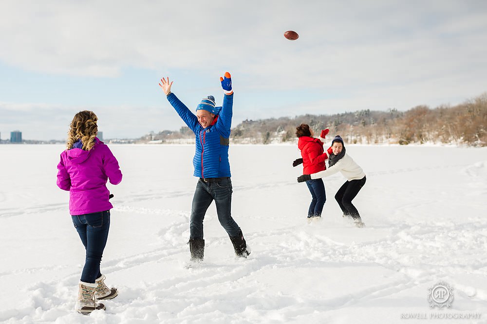 family plays football int he snow