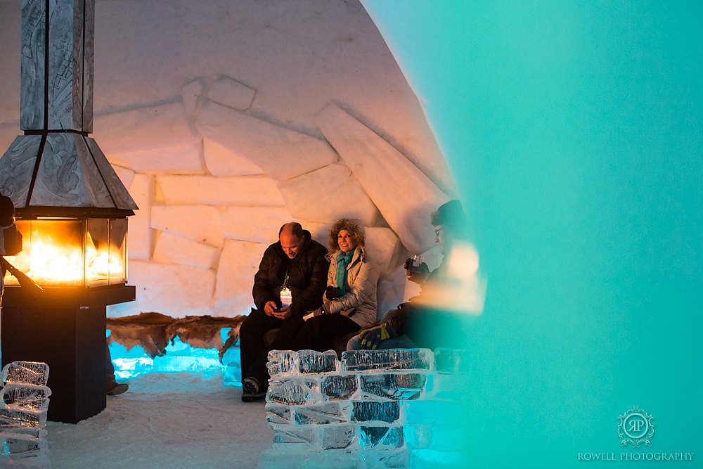 Romantic photos of Hotel de Glace couples by the fire