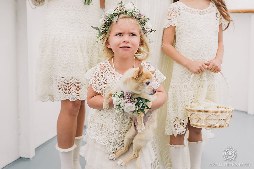 adoable flower girl with puppy at muskoka wedding