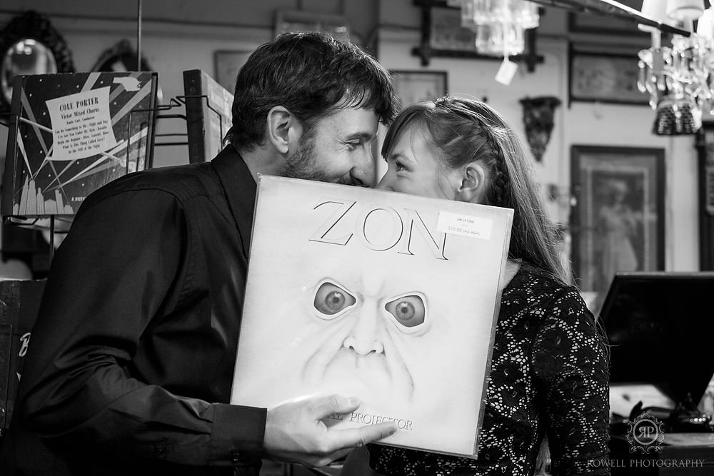 Fun engagement photos at record shop