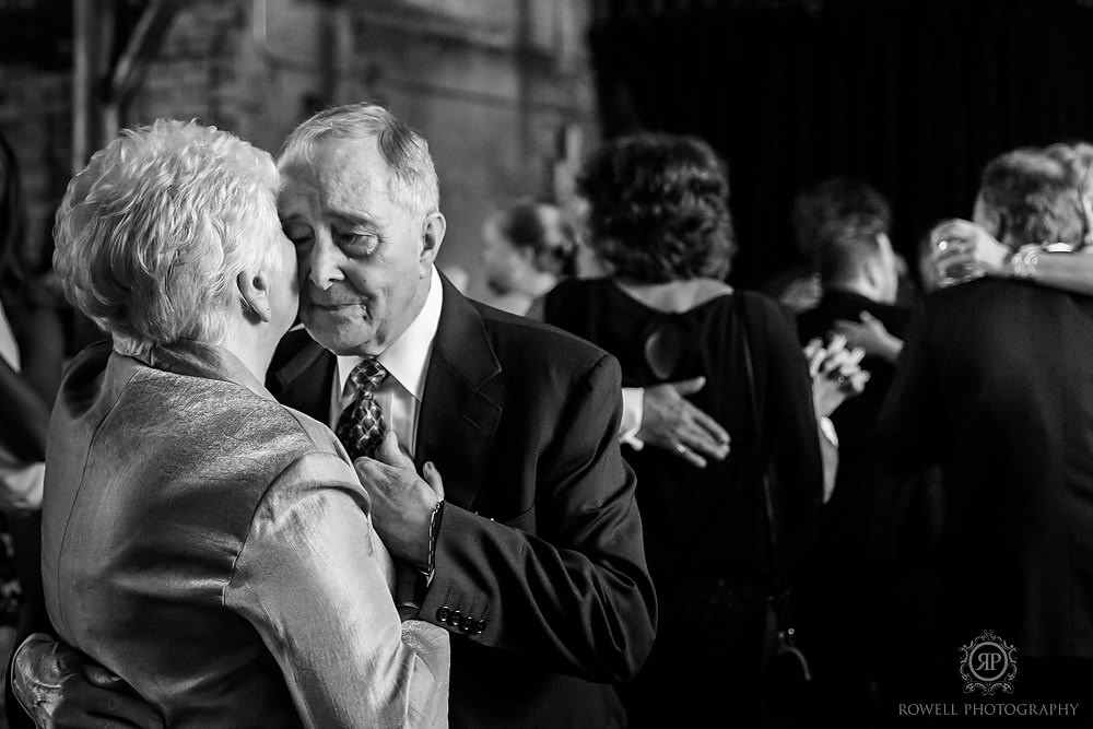 romantic old couple dancing at wedding