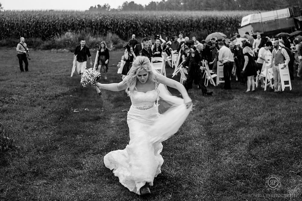 bride running from the rain canada weddingceremony