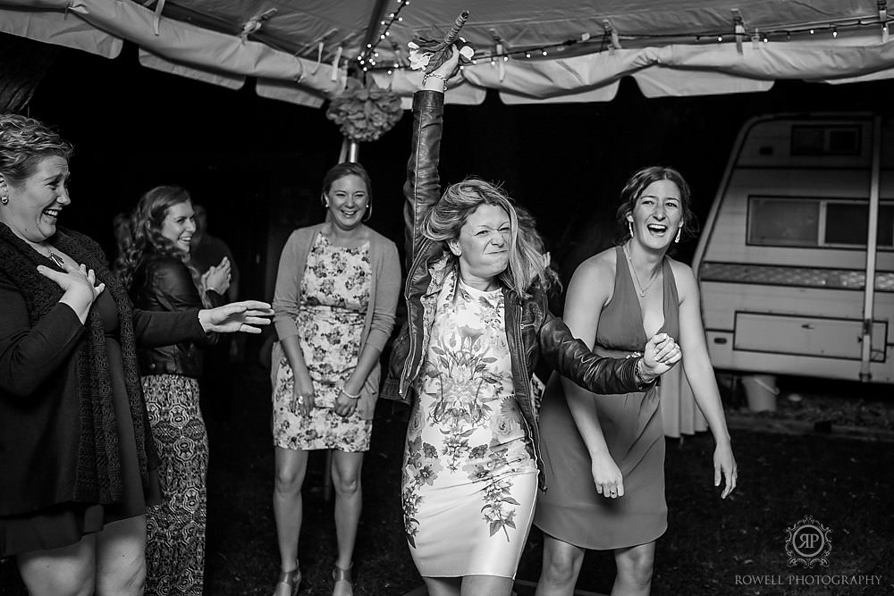 fierce wedding guest catches bouquet