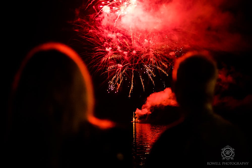 a romantic backyard wedding guest watching fireworks